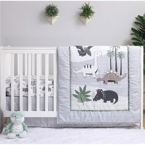 The Peanutshell Dinosaur Crib bedding set with mobile